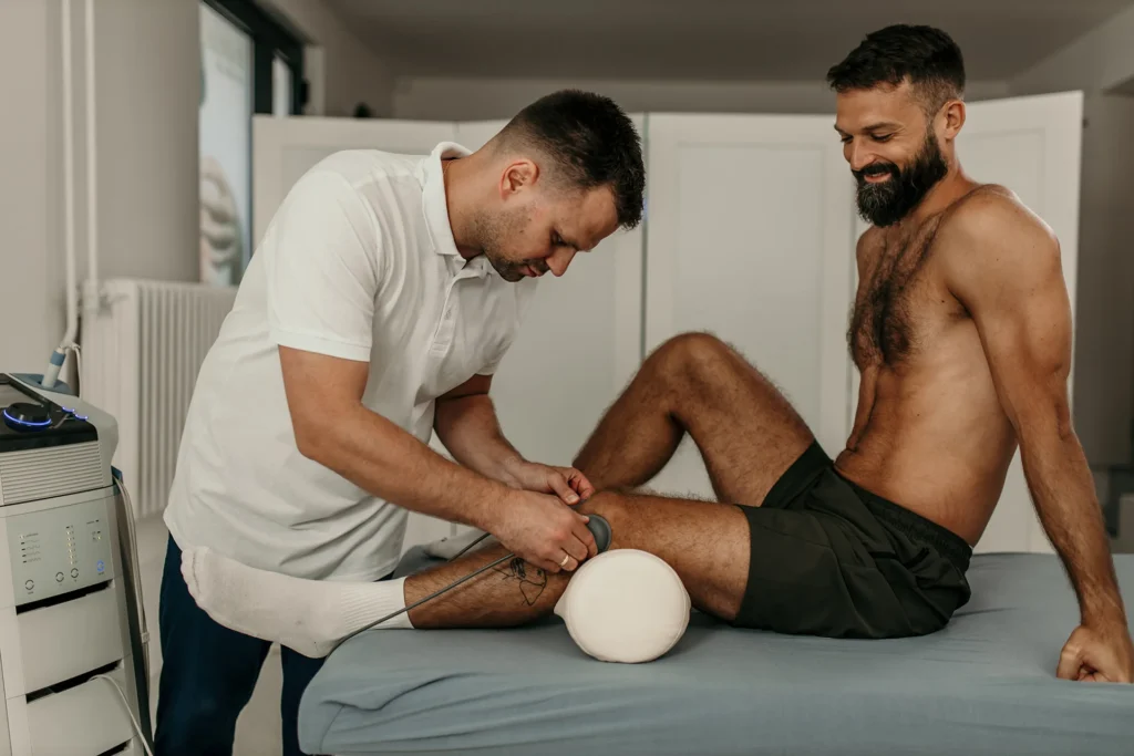 man receiving ultrasound treatment on leg